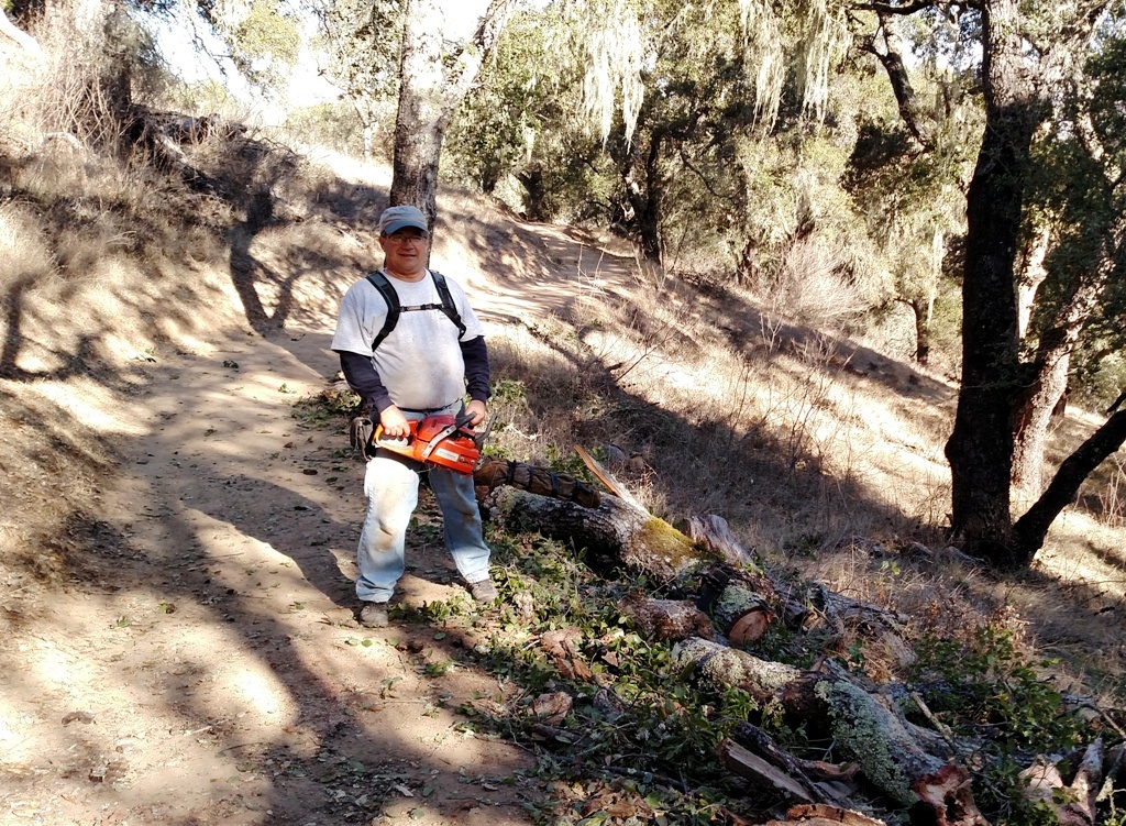 Mike after finishing cutting up the fallen branch.